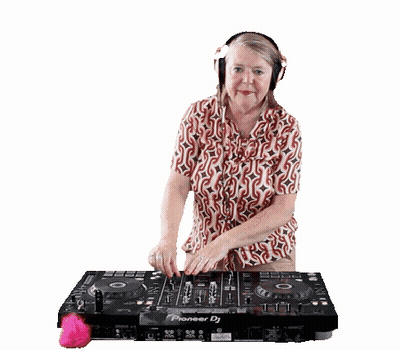 A Woman Wearing Headphones Stands In Front Of A Pioneer Dj Controller GIF