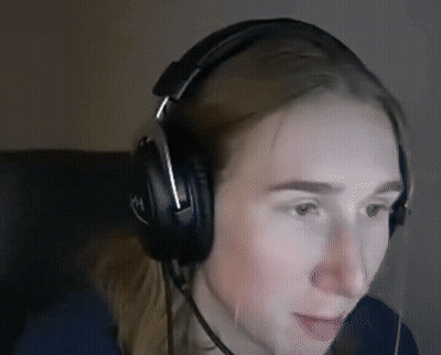 A Woman Wearing Headphones With The Letter H On The Side GIF