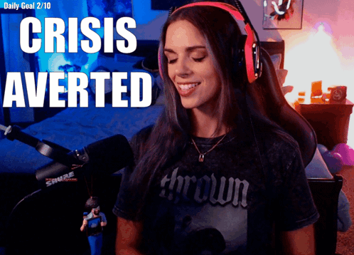 A Woman Wearing Headphones With The Words Crisis Averted GIF
