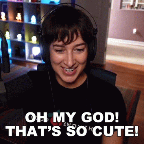 A Woman Wearing Headphones With The Words Oh My God That 'S So Cute GIF