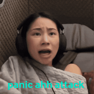 A Woman Wearing Headphones With The Words Panic Ahh Attack Written Below Her GIF