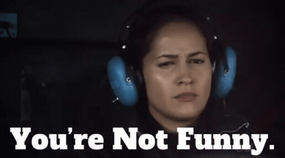 A Woman Wearing Headphones With The Words " You 'Re Not Funny " Below Her GIF