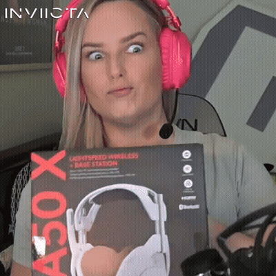 A Woman Wearing Pink Headphones Is Holding A Box That Says A50 X On It GIF