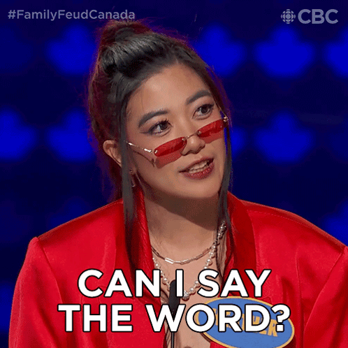 A Woman Wearing Red Sunglasses And A Red Jacket Says Can I Say The Word GIF