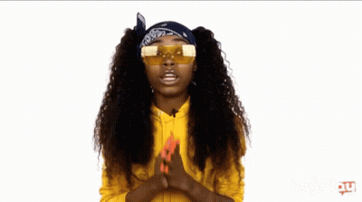 A Woman Wearing Sunglasses And A Bandana On Her Head GIF
