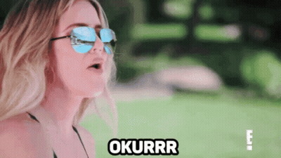 A Woman Wearing Sunglasses And A Bikini Says Okurrr . GIF