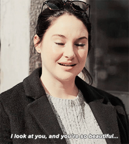 A Woman Wearing Sunglasses And A Black Coat Says I Look At You And You 'Re So Beautiful GIF