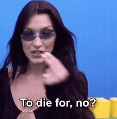 A Woman Wearing Sunglasses And A Black Top Is Asking To Die For , No ? GIF