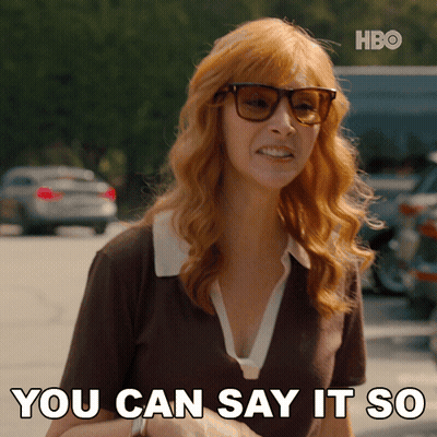 A Woman Wearing Sunglasses And A Brown Shirt Says You Can Say It So GIF