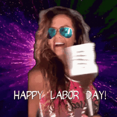 A Woman Wearing Sunglasses And A Hat Is Holding A Megaphone And Says Happy Labor Day GIF