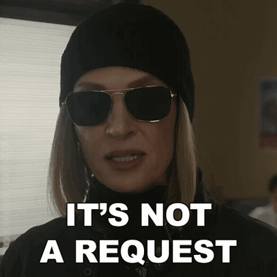 A Woman Wearing Sunglasses And A Hat Says " It 'S Not A Request " GIF