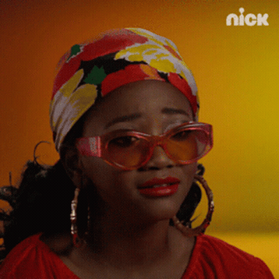 A Woman Wearing Sunglasses And A Head Scarf With Nick On The Bottom Right GIF