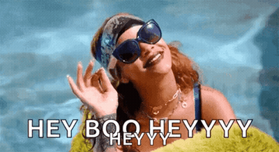 A Woman Wearing Sunglasses And A Headband Says " Hey Boo Heyyyy " GIF