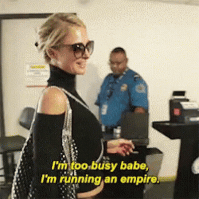 A Woman Wearing Sunglasses And A Turtleneck Says I 'M Too Busy Babe I 'M Running An Empire GIF