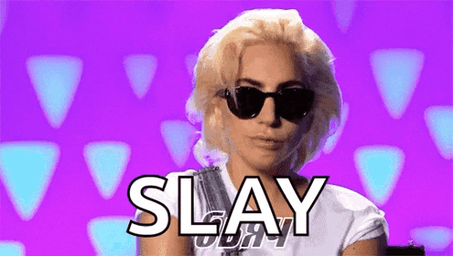 A Woman Wearing Sunglasses And A White Shirt Is Standing In Front Of A Purple Background And Says Slay . GIF