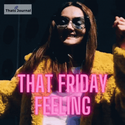 A Woman Wearing Sunglasses And A Yellow Coat Is Dancing With The Words That Friday Feeling Behind Her GIF