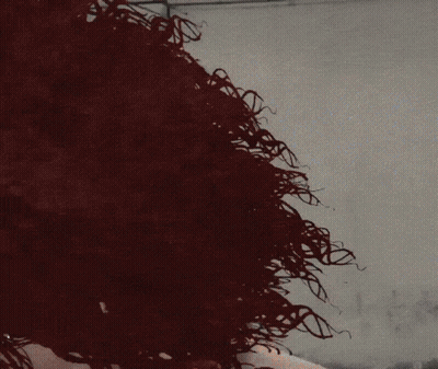 A Woman Wearing Sunglasses Has A Tattoo On Her Neck GIF
