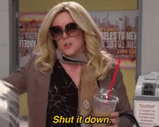 A Woman Wearing Sunglasses Is Holding A Cup Of Coffee And Saying Shut It Down GIF