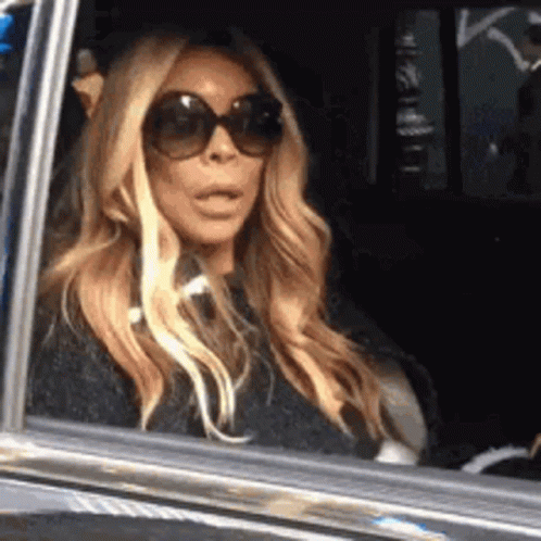 Woman Looking Out Car Window GIF
