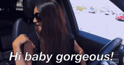 A Woman Wearing Sunglasses Is Sitting In A Car With The Words Hi Baby Gorgeous Below Her GIF