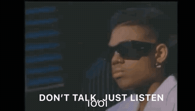 A Woman Wearing Sunglasses Is Sitting In Front Of A Window And Says `` Do N't Talk Just Listen '' . GIF