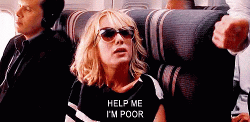 A Woman Wearing Sunglasses Is Sitting On A Plane Asking For Help . GIF