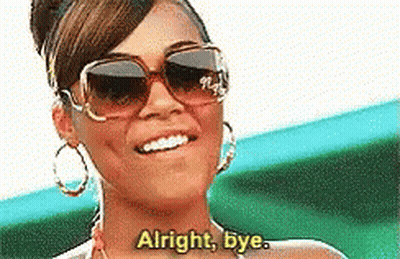 A Woman Wearing Sunglasses Is Smiling And Saying Alright Bye GIF