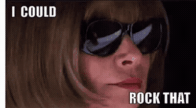 A Woman Wearing Sunglasses Says " I Could Rock That " On The Bottom GIF