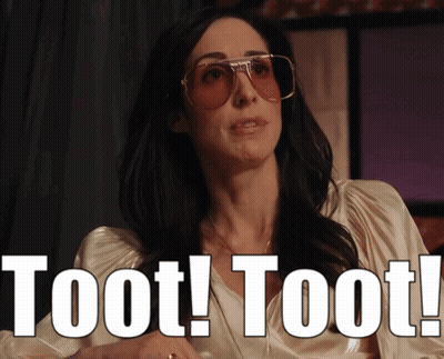 A Woman Wearing Sunglasses Says " Toot Toot " In White Letters GIF