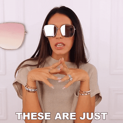 A Woman Wearing Sunglasses With The Words These Are Just Above Her GIF