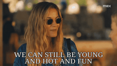 A Woman Wearing Sunglasses With The Words We Can Still Be Young And Hot And Fun GIF