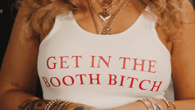 A Woman Wears A Tank Top That Says Get In The Booth Bitch GIF