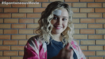 A Woman With A Bandage On Her Forehead Is Giving A Thumbs Up GIF