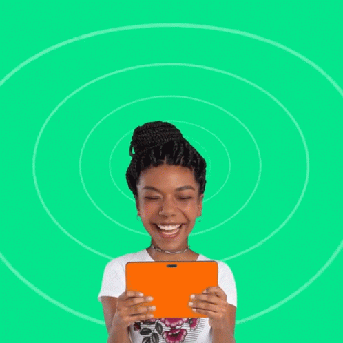 A Woman With A Big Head Is Smiling And Holding A Tablet GIF