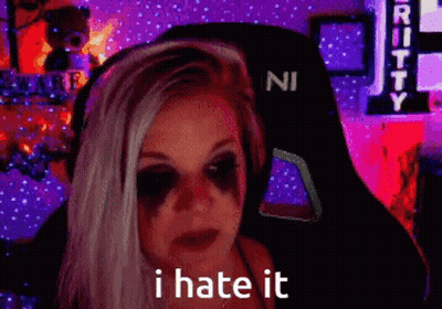 A Woman With A Black Eye Has The Words I Hate It On Her Face . GIF
