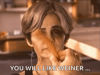 A Woman With A Black Eye Is Holding A Carrot In Her Mouth And Saying You Will Like Weiner ... GIF