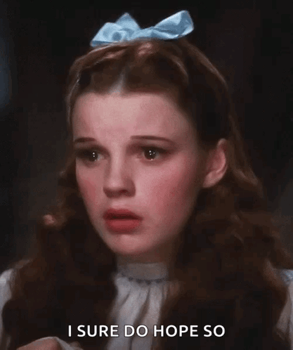 A Woman With A Blue Bow On Her Head Says I Sure Do Hope So GIF