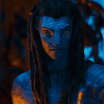 A Woman With A Blue Face And Braided Hair Is Wearing A Scarf That Says ' Snake ' On It GIF