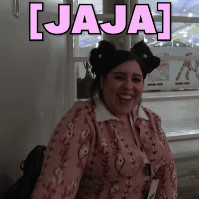 A Woman With A Bow In Her Hair Is Smiling In Front Of A Sign That Says ' Jaja ' GIF
