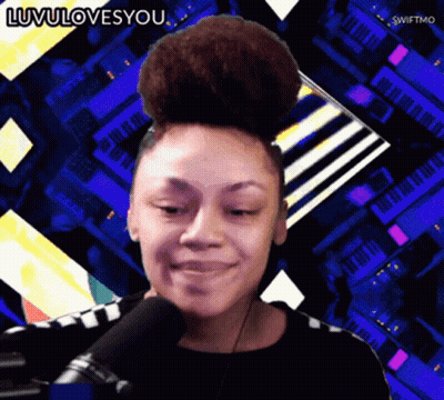 A Woman With A Bun On Her Head Is Smiling In Front Of A Microphone With The Words Luvulovesyou Below Her GIF