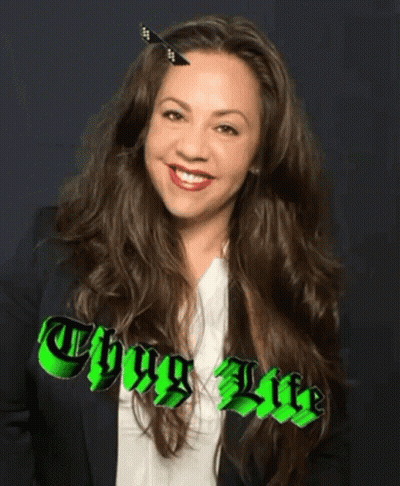A Woman With A Butterfly In Her Hair And The Words Thug Life GIF