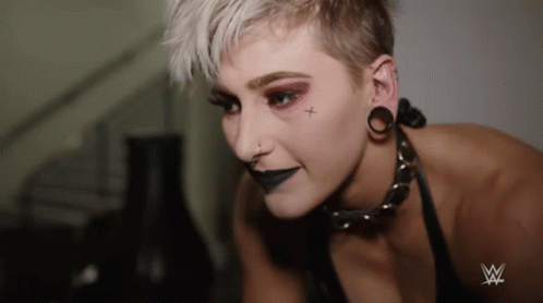 A Woman With A Cross On Her Face Is Wearing A Choker GIF