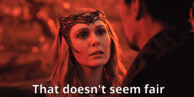 A Woman With A Crown On Her Head Is Looking At A Man With The Words That Does N't Seem Fair Below Her GIF