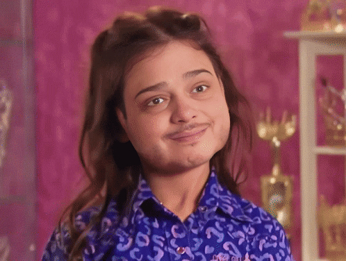 A Woman With A Fake Mustache Is Wearing A Leopard Print Shirt . GIF