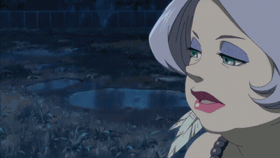 A Woman With A Feather In Her Mouth Is Making A Funny Face GIF