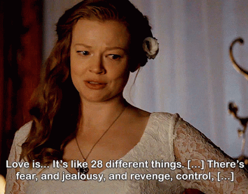 A Woman With A Flower In Her Hair Has A Quote About Love GIF