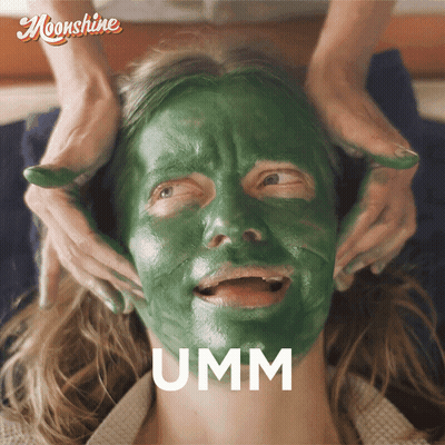 A Woman With A Green Mask On Her Face Has The Word Umm Above Her Face GIF