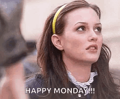 A Woman With A Headband On Her Head Is Looking Up And Saying `` Happy Monday '' . GIF