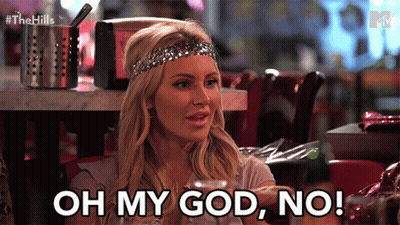 A Woman With A Headband On Her Head Says " Oh My God No " GIF