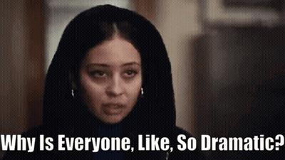 A Woman With A Hood On Her Head Says " Why Is Everyone Like So Dramatic ? " GIF